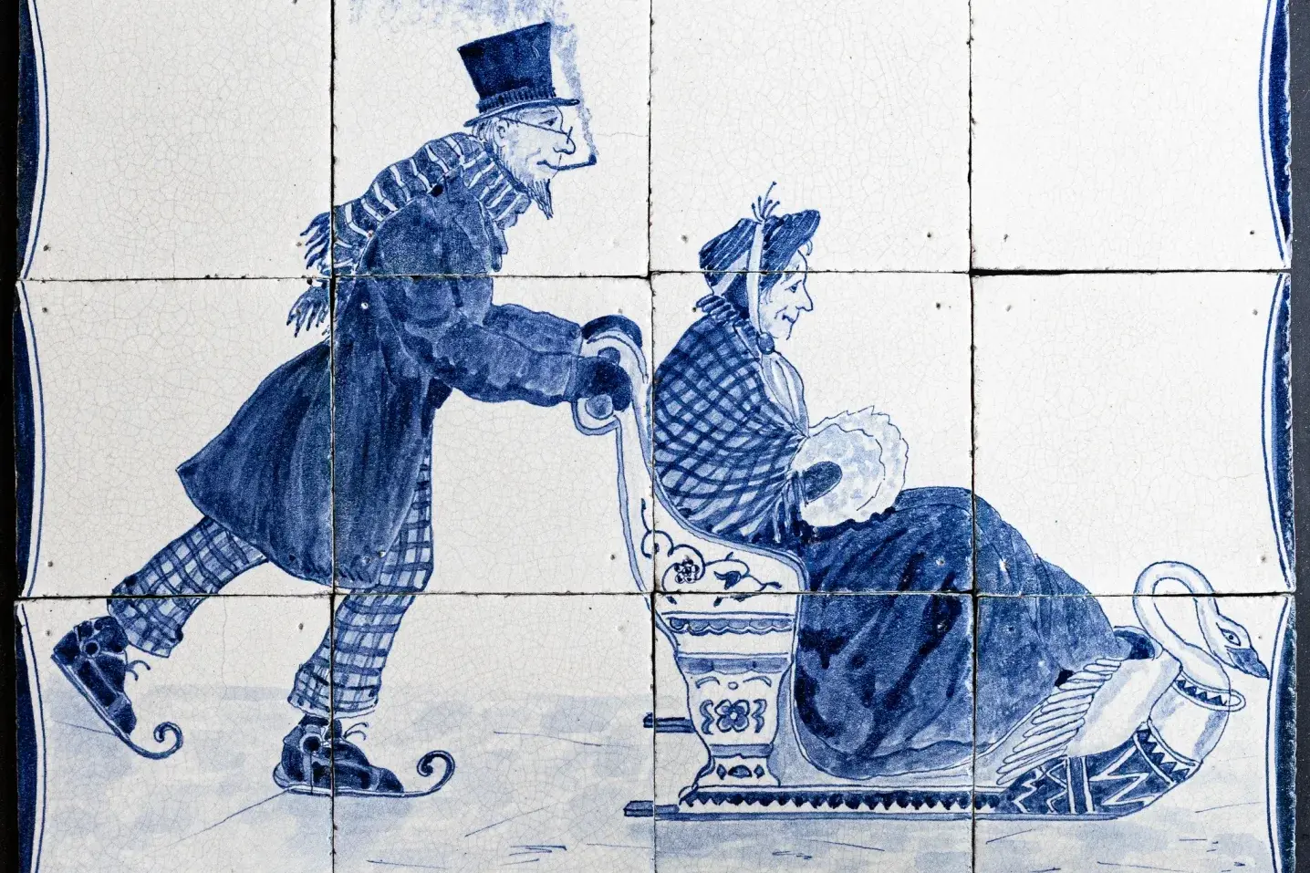 Antique hand-painted Delft-blue tile panel depicting a sleigh