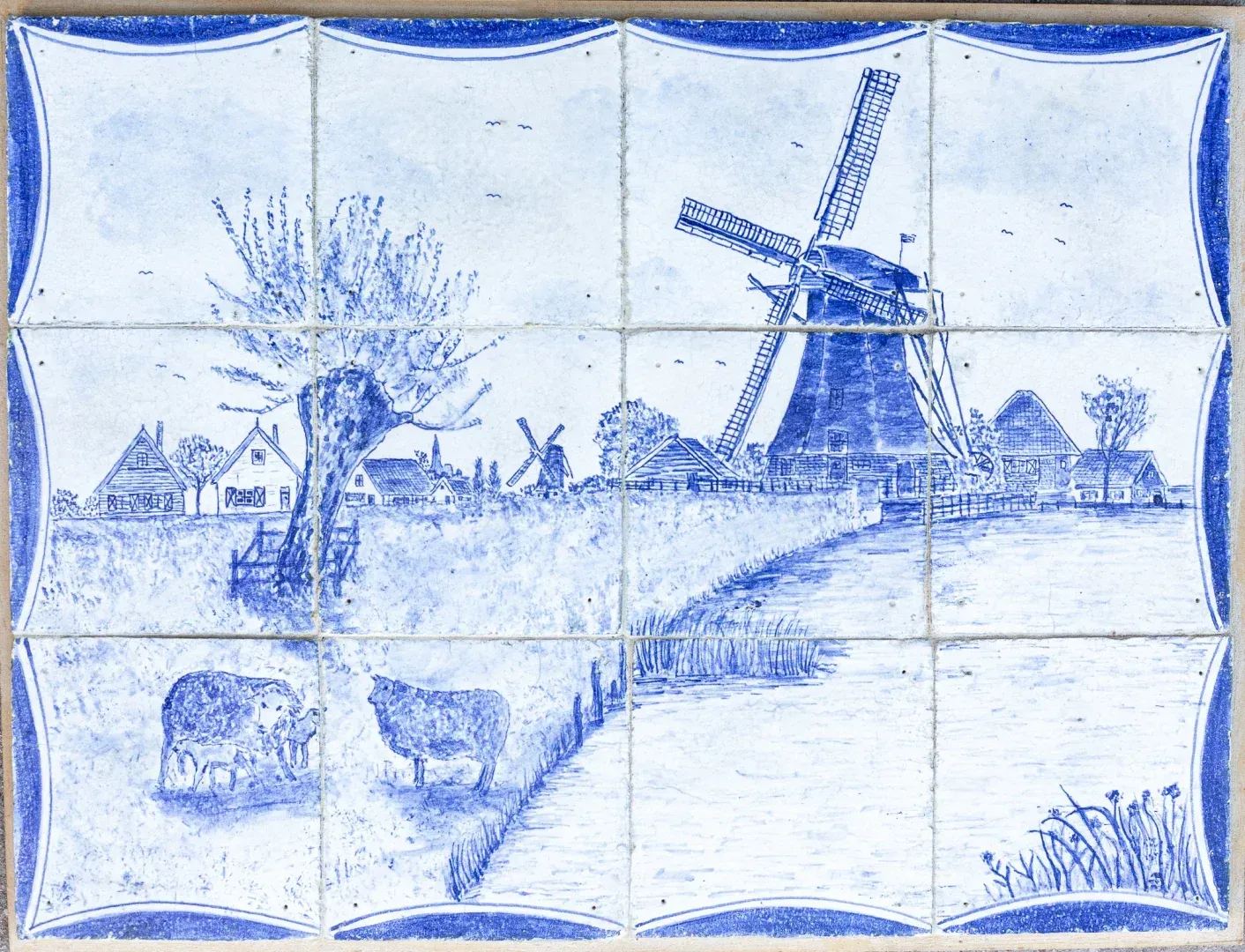 Panneau bleu de Delft en carreaux représentant un paysage