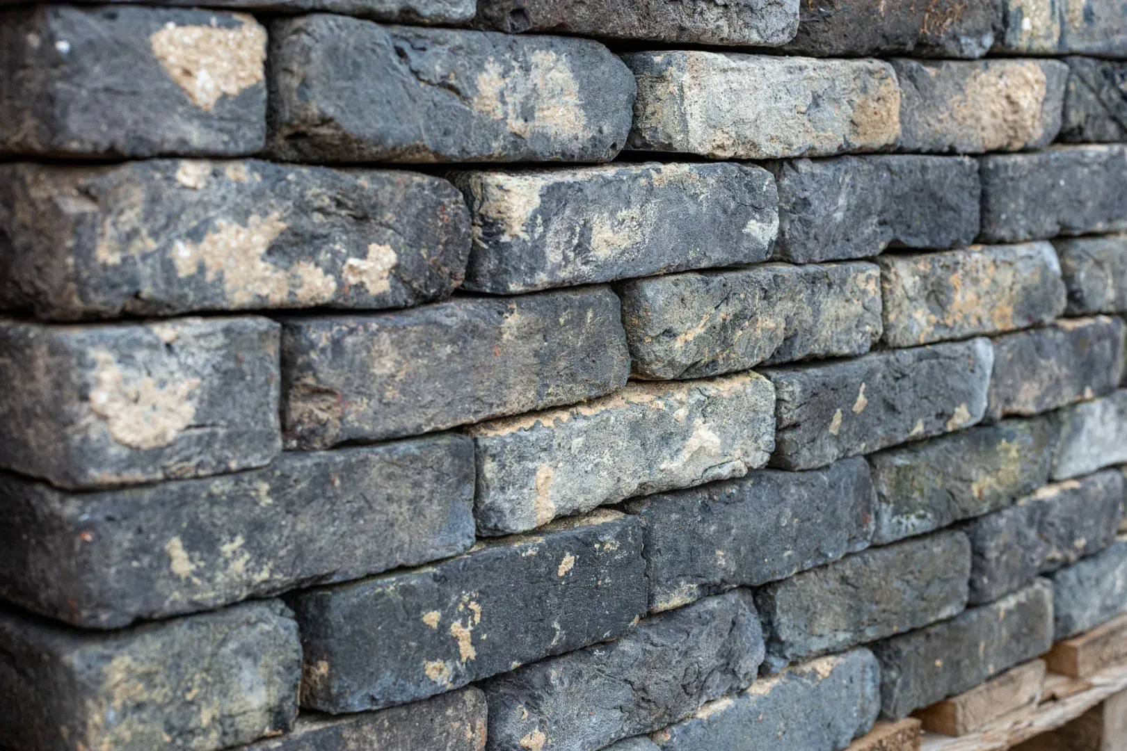 Grey masonry bricks cleaned of mortar