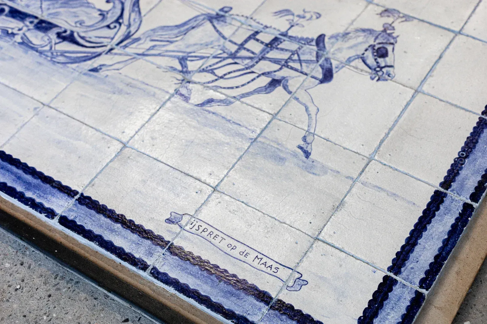 Antique tile panel depicting winter fun on the Meuse