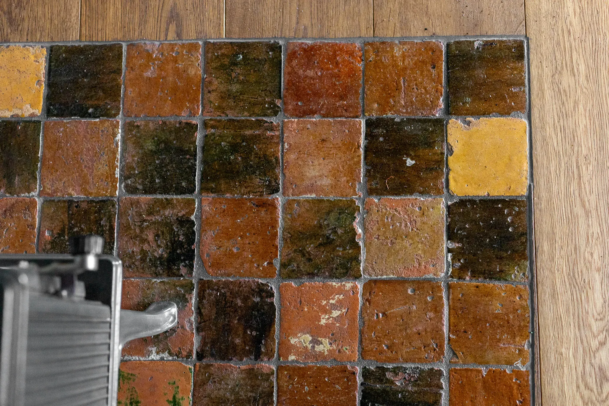 Mix of antique glazed terracotta floor tiles