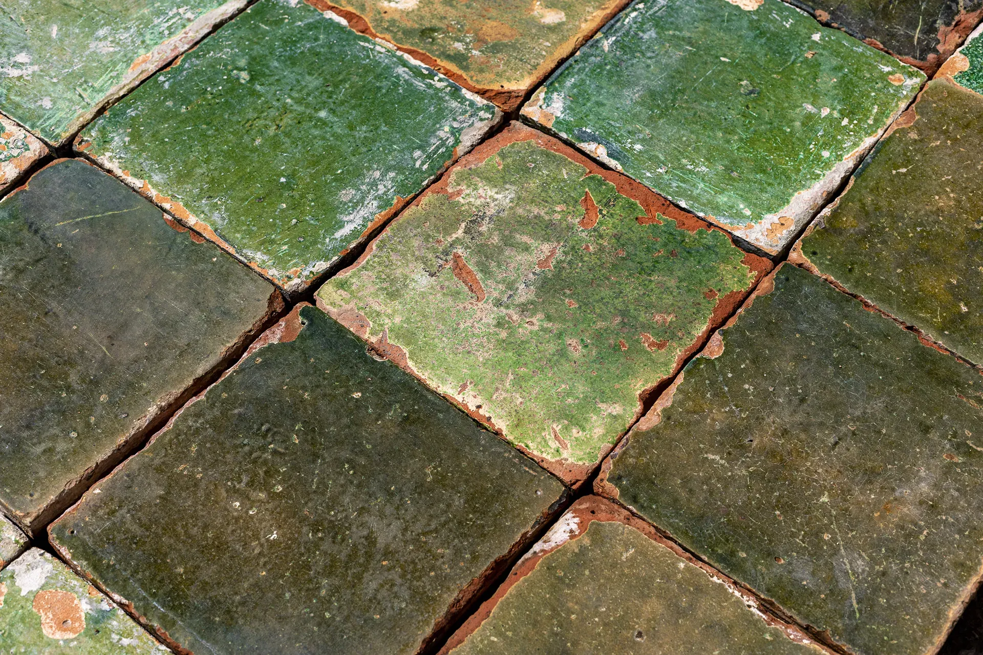 Intact green-glazed farmhouse floor tiles