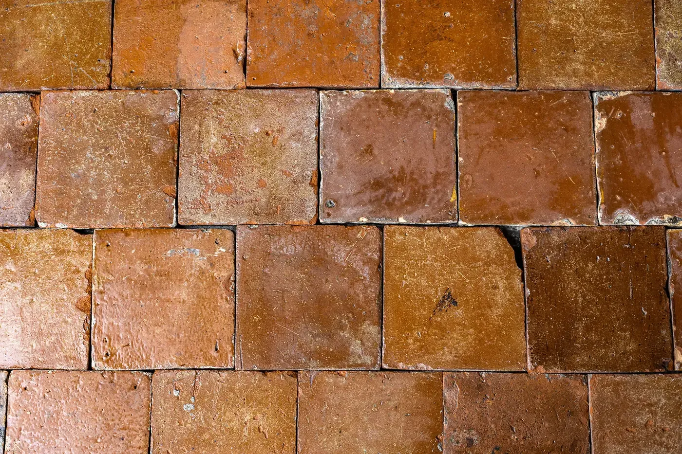 Brown-glazed terracotta floor tiles