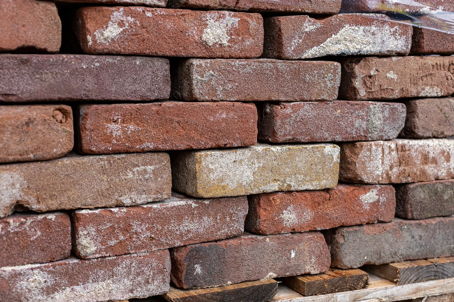 Dark nuanced masonry bricks cleaned of mortar
