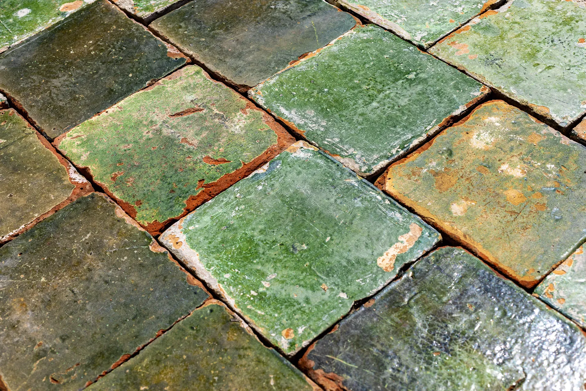 Old green-glazed floor tiles