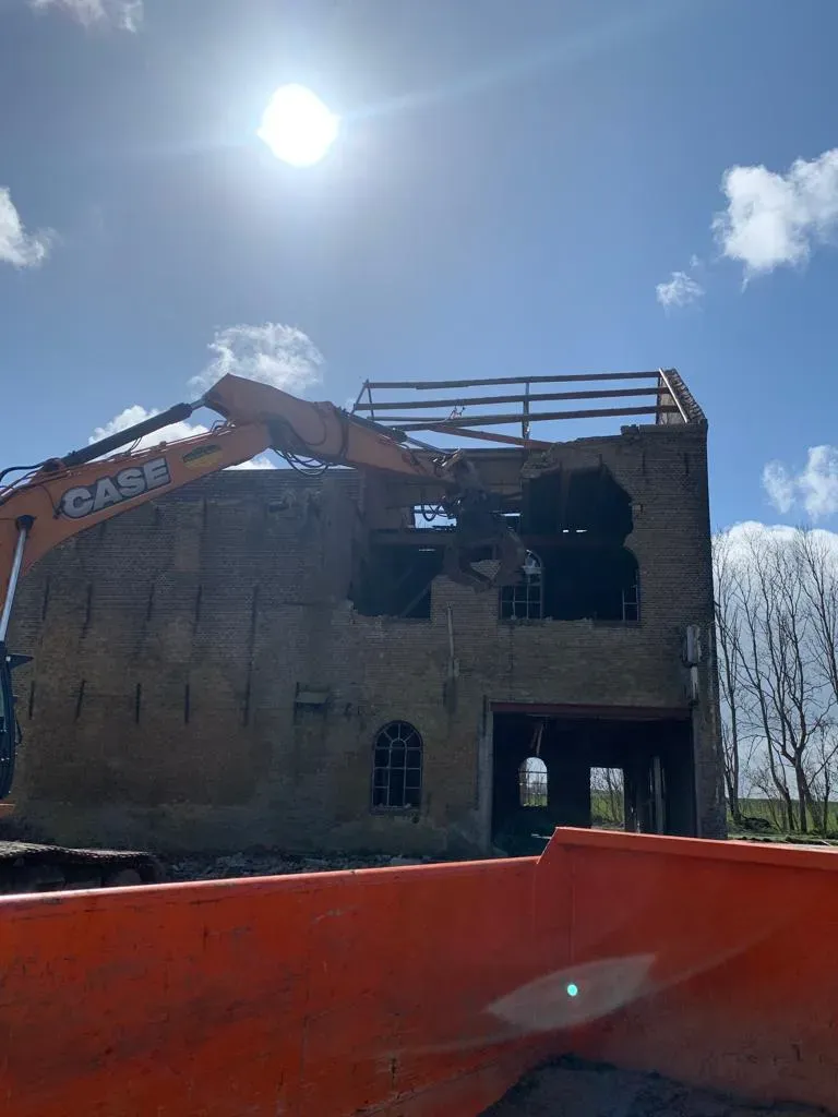 How do you demolish an old house?