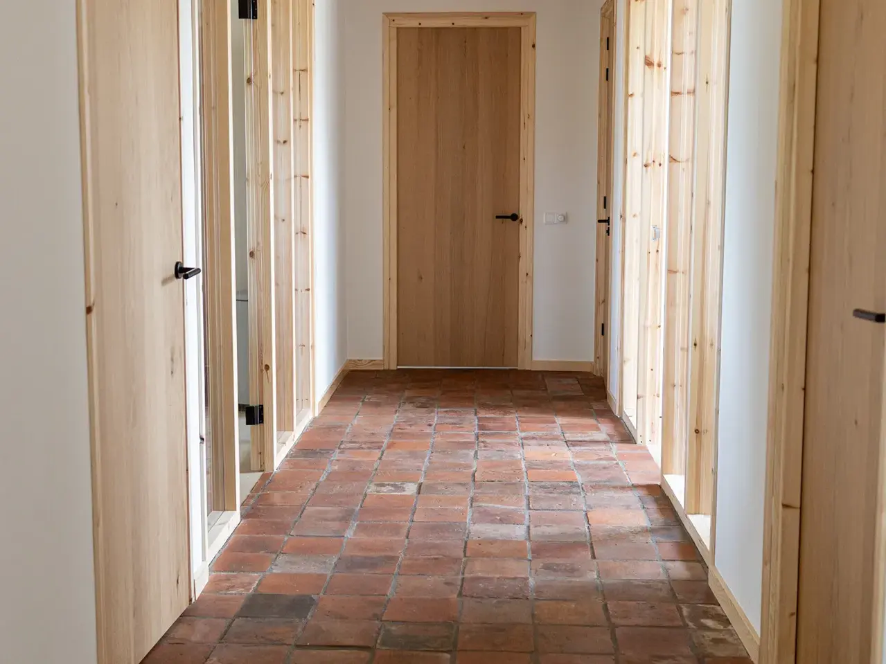 Old red Dutch antique terracotta floor tiles in Opeinde