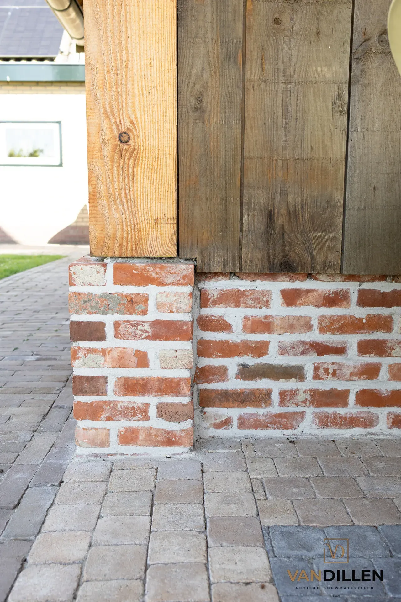 Old red moulded bricks used as a plinth