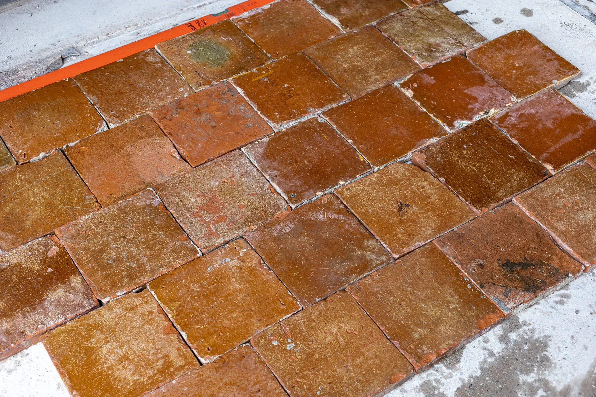 Old brown-glazed floor tiles