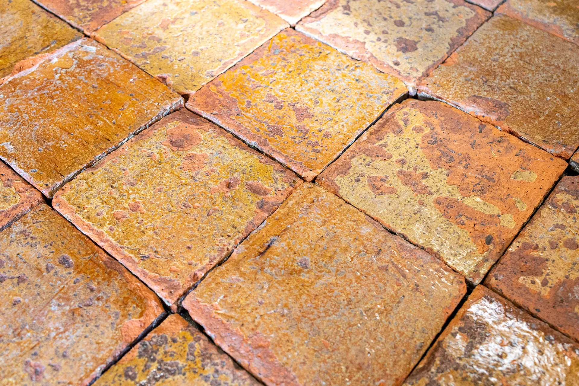 Old glazed floor with signs of use