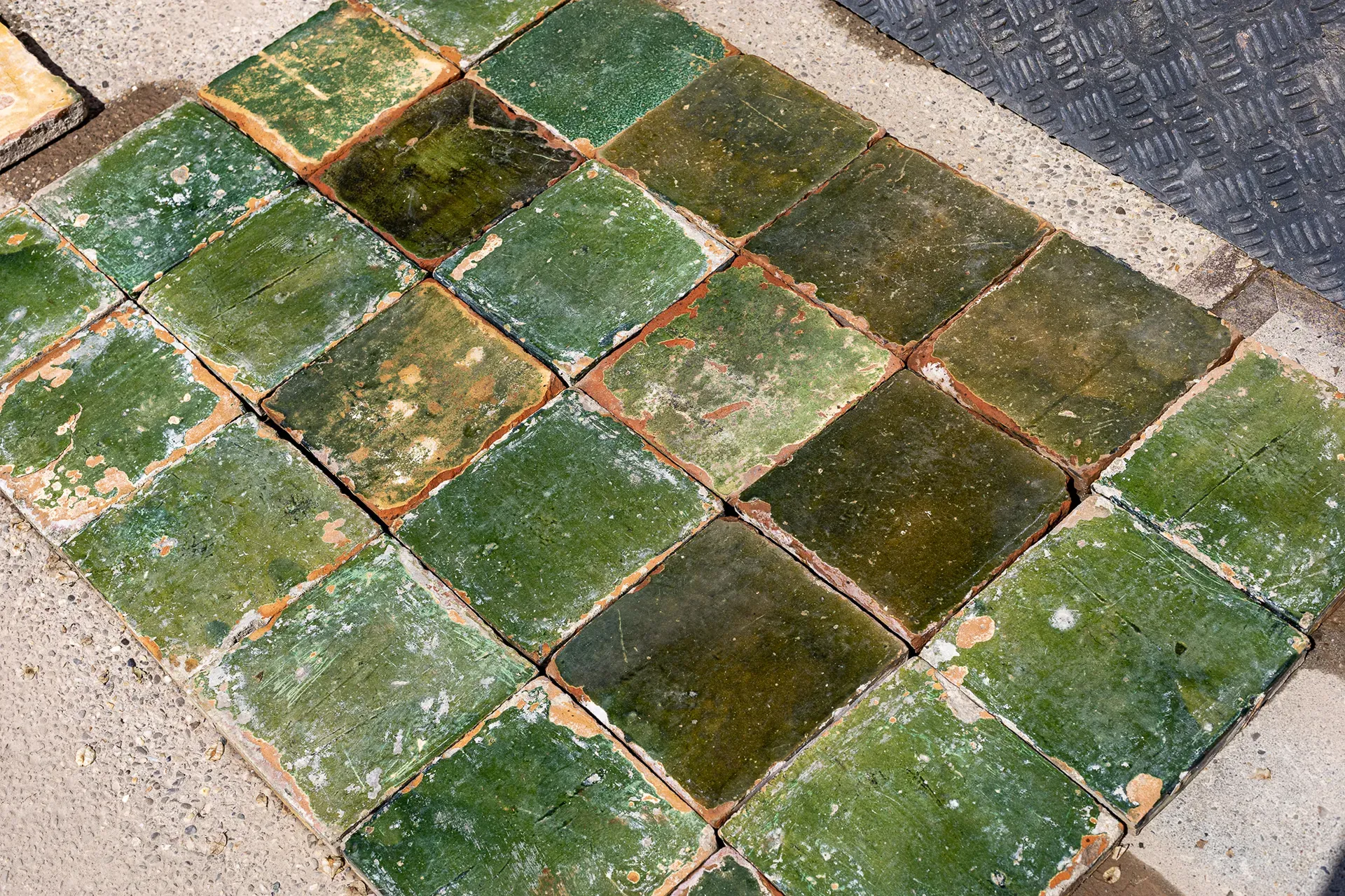 Old green-glazed floor tiles