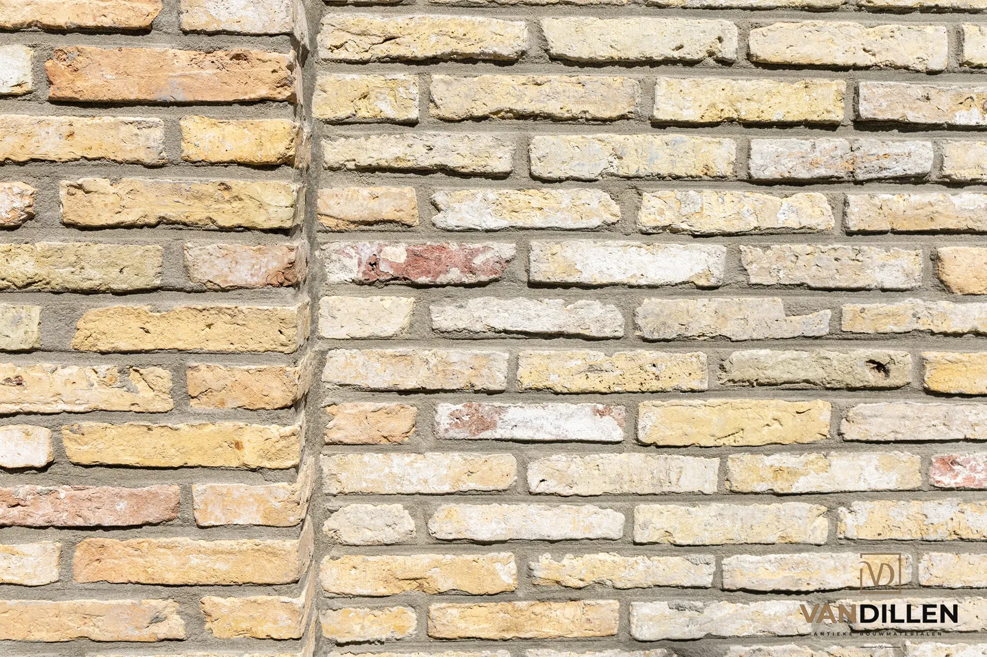 Small-format old Frisian yellow bricks as a stylish garden wall in Friesland